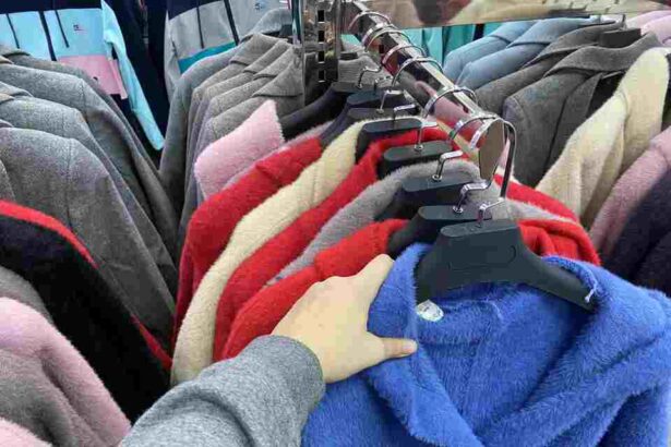 woman chooses a coat jacket in the store a wom 2025 02 25 03 00 07 utc 1