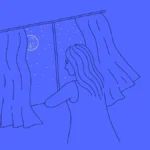 mixkit woman staring out the window looking at the night sky 25 original