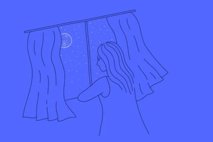 mixkit woman staring out the window looking at the night sky 25 original