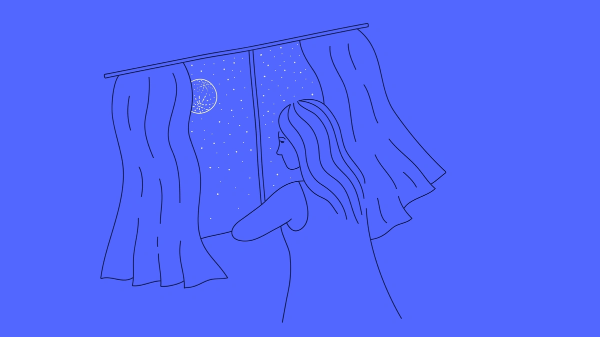 mixkit woman staring out the window looking at the night sky 25 original