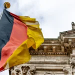 almanya vinnikava german flag waving in front of the building in mun 2022 11 14 05 19 37 utc