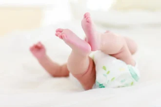 baby lying in bed 2025 04 04 09 52 44 utc