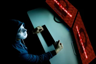 masked hacker under hood using computer to hack in 2025 01 29 23 13 43 utc