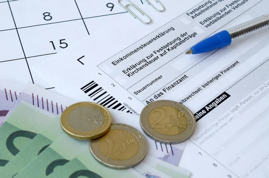 german tax form with pen and european money bills 2025 03 15 23 04 41 utc