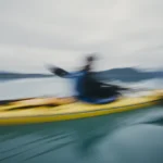 man sea kayaking inan inlet on the alaska coastlin 2025 04 04 05 36 12 utc