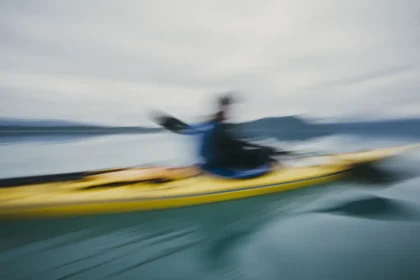 man sea kayaking inan inlet on the alaska coastlin 2025 04 04 05 36 12 utc
