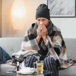 sick sad man sits on couch at home suffers from ru 2025 03 14 13 37 19 utc 1