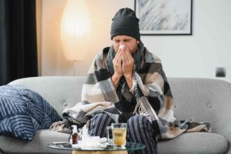 sick sad man sits on couch at home suffers from ru 2025 03 14 13 37 19 utc 1